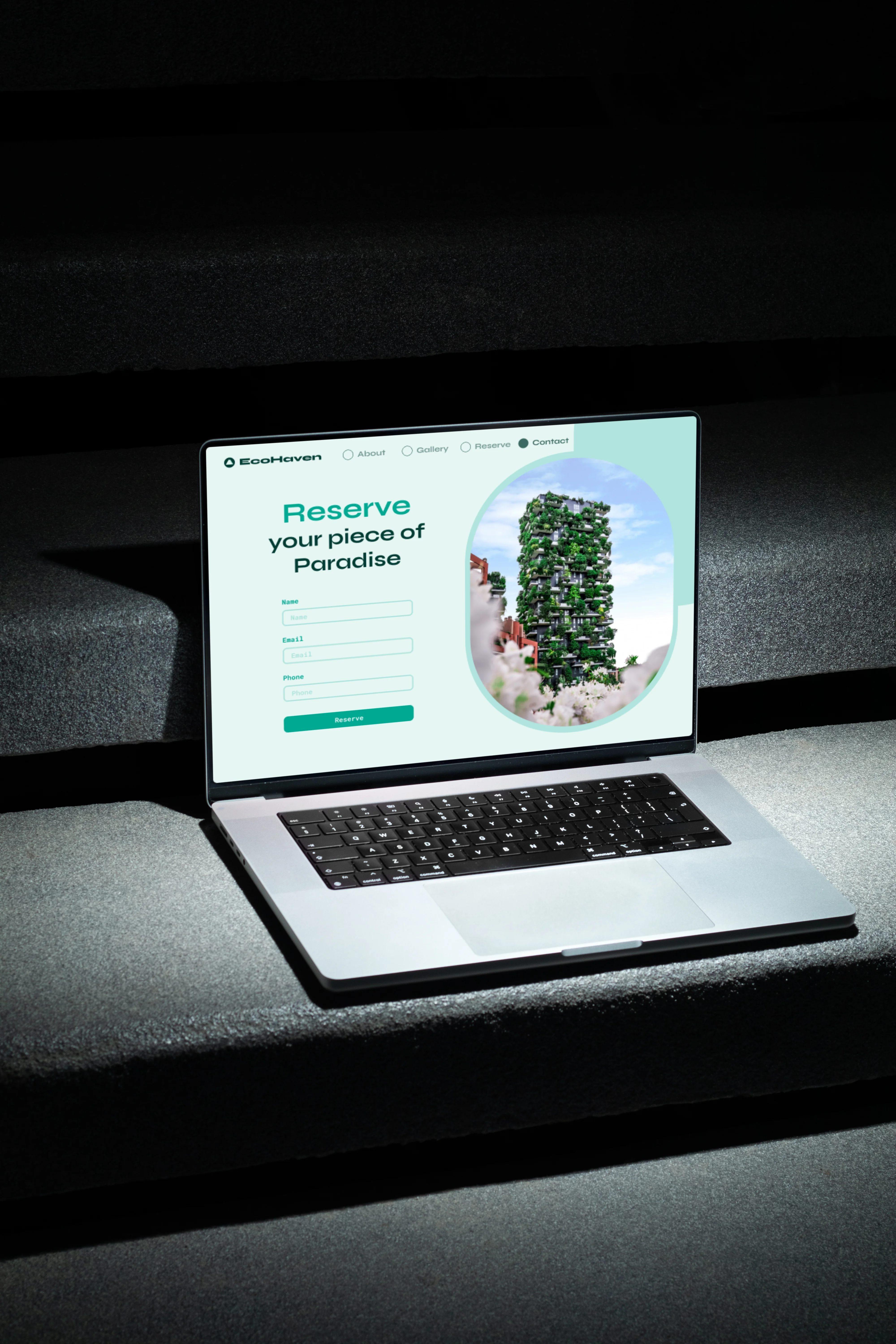 Laptop mockup displaying the EcoHaven reservation landing page.
