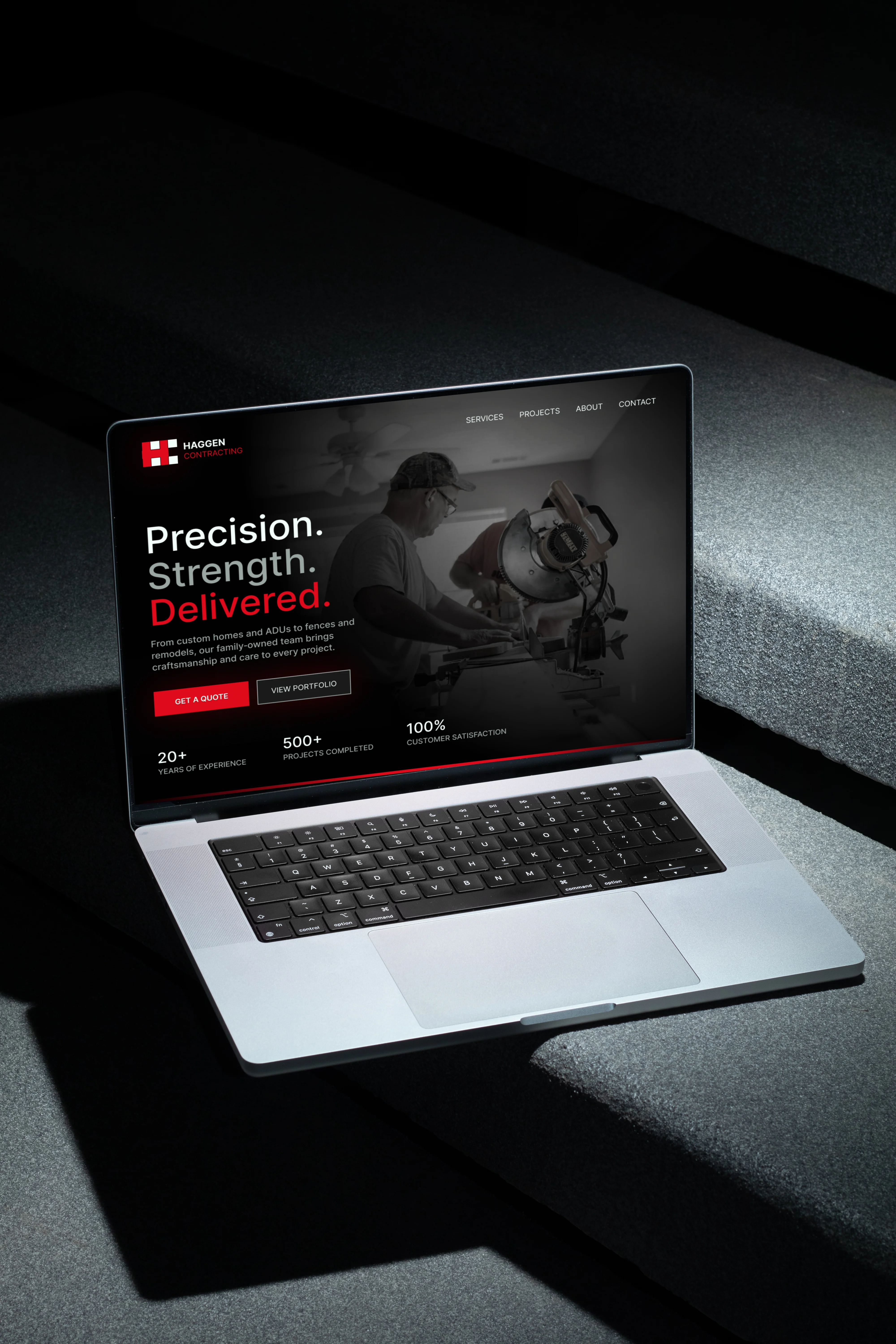 Laptop mockup displaying the Haggen Contracting website.